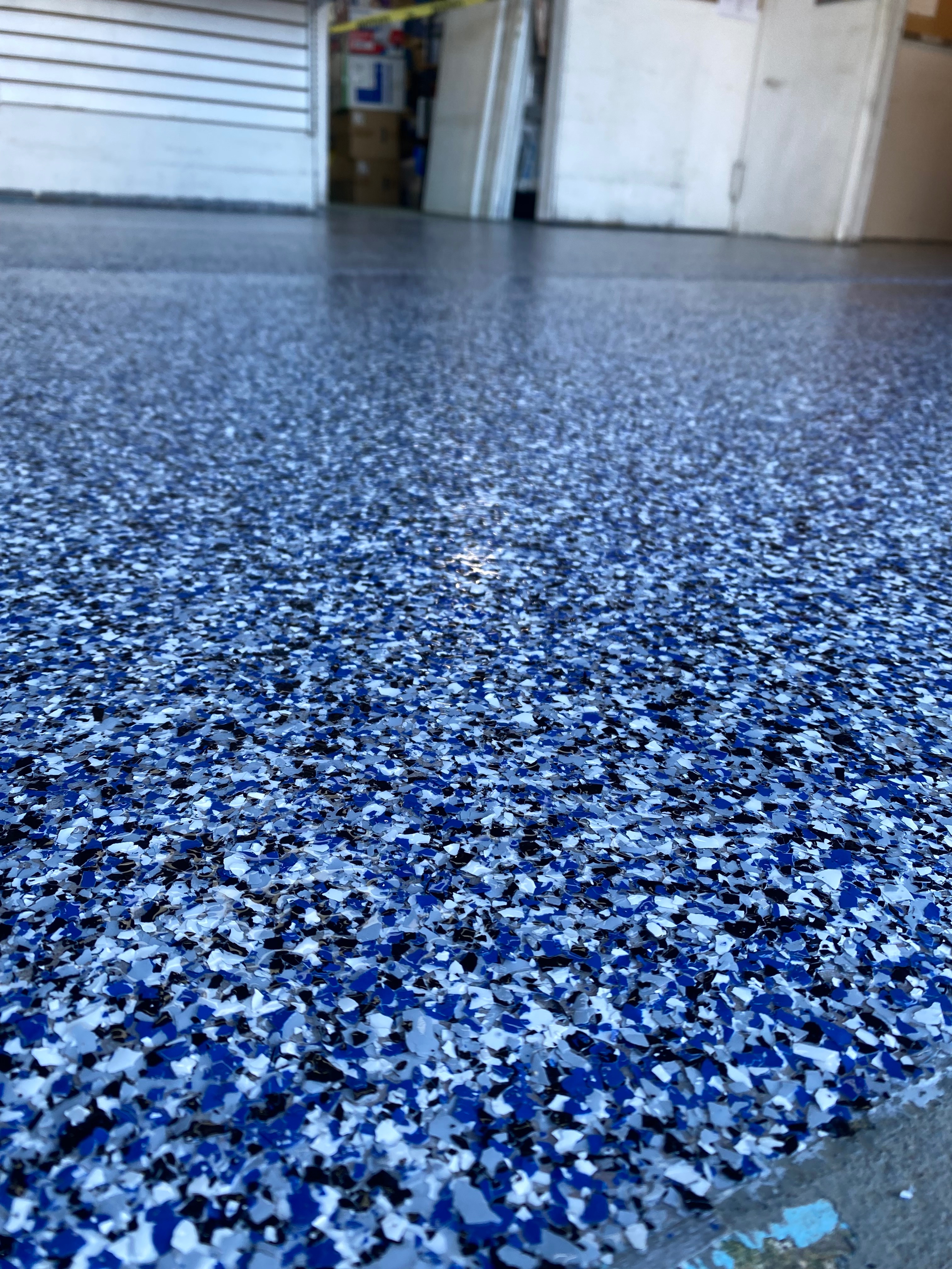 Decorative flake epoxy flooring with textured multi-color finish