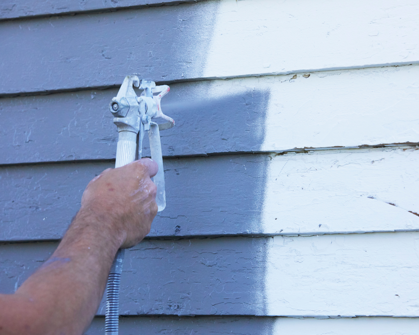 Exterior home painting project featuring fresh siding color, crisp trim lines, and professionally applied weather-resistant coating.