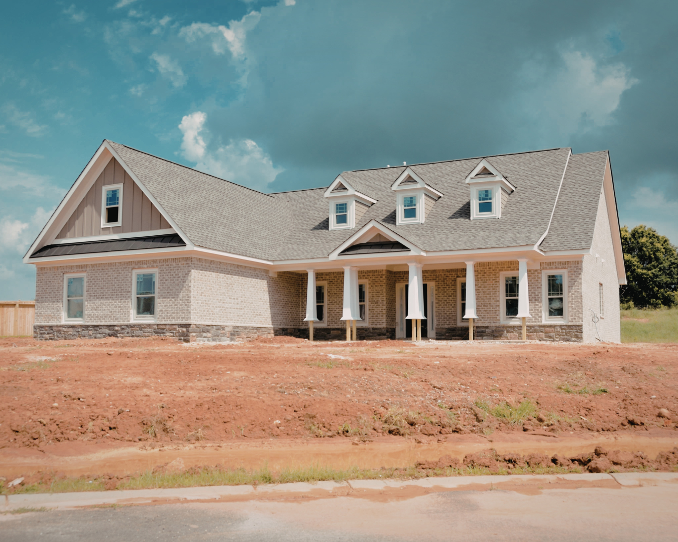 New home construction project showing framed structure and professional build progress on residential property.