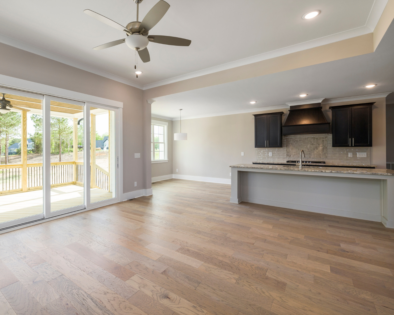 Professional flooring installation project featuring hardwood planks laid evenly with clean transitions and smooth finish.