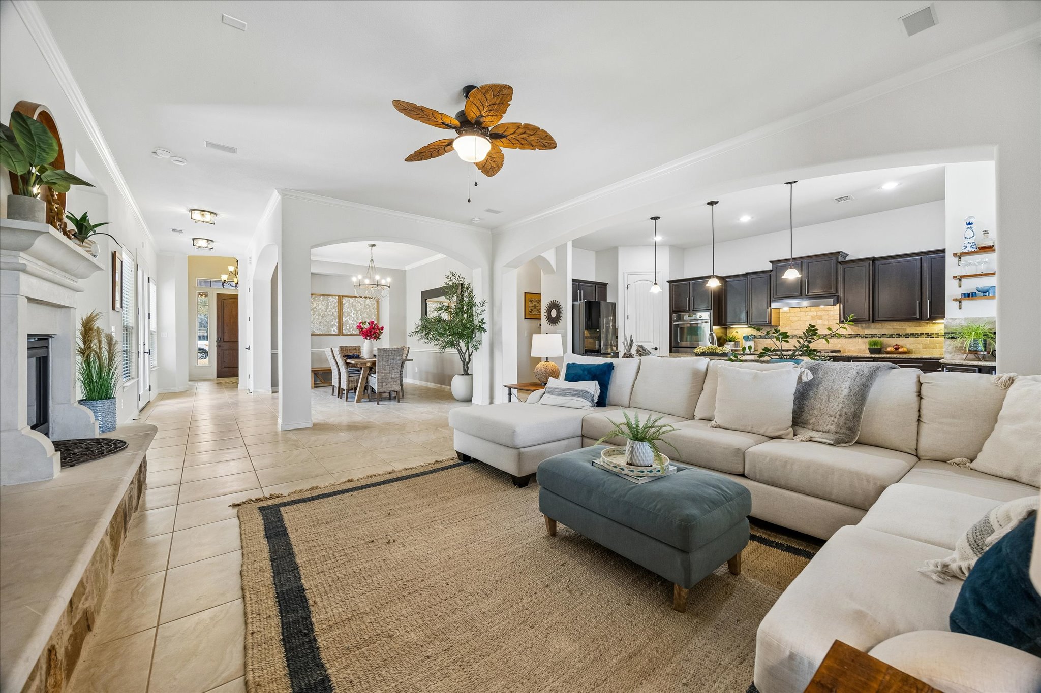 Great room with floor-to-ceiling stone fireplace and coffered ceilings