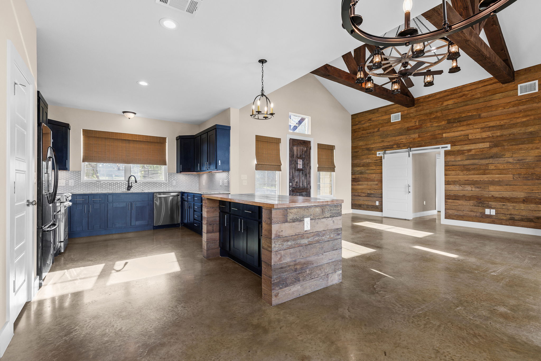 Kitchen and living open concept with wagon wheel chandelier