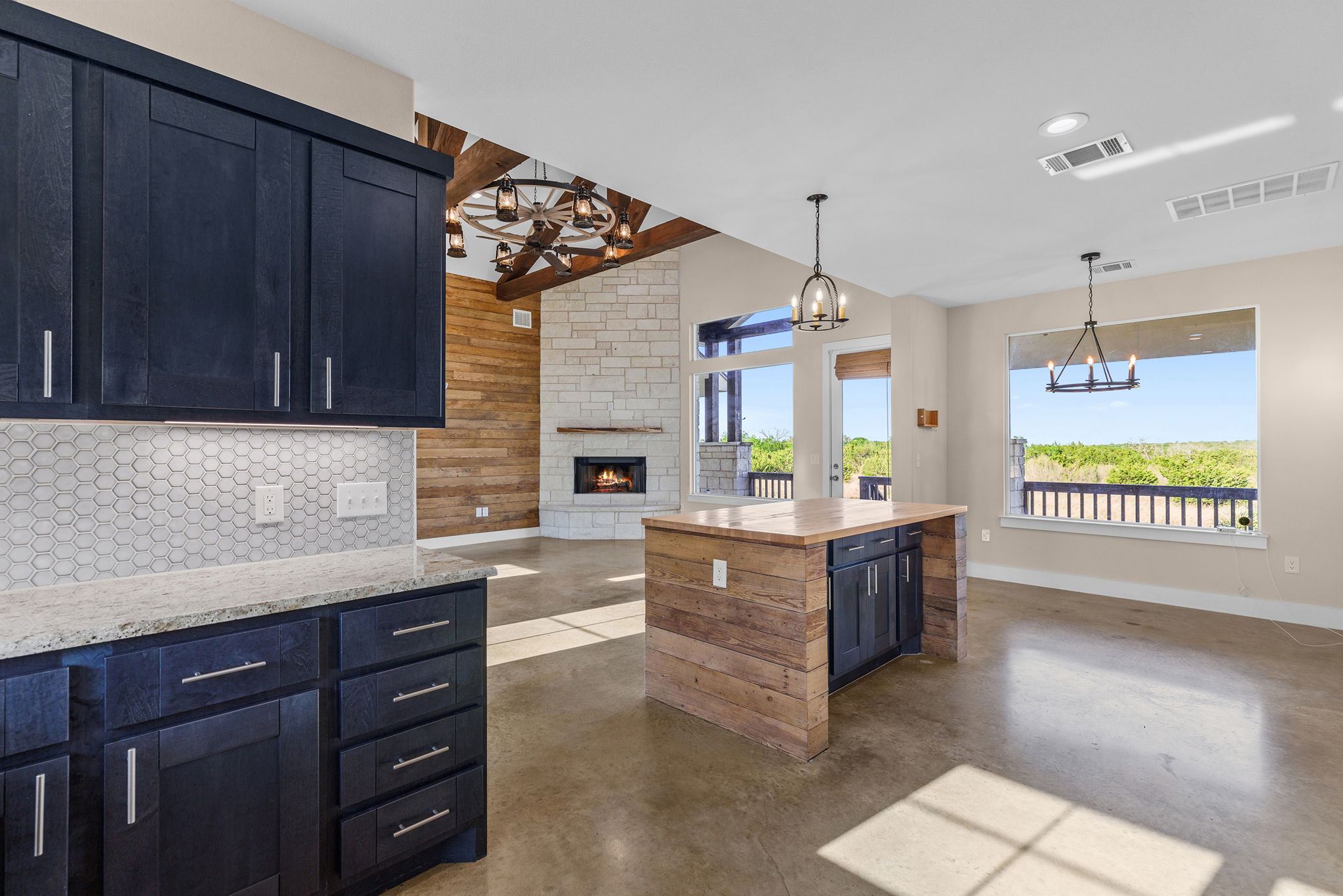 Kitchen with island and fireplace view