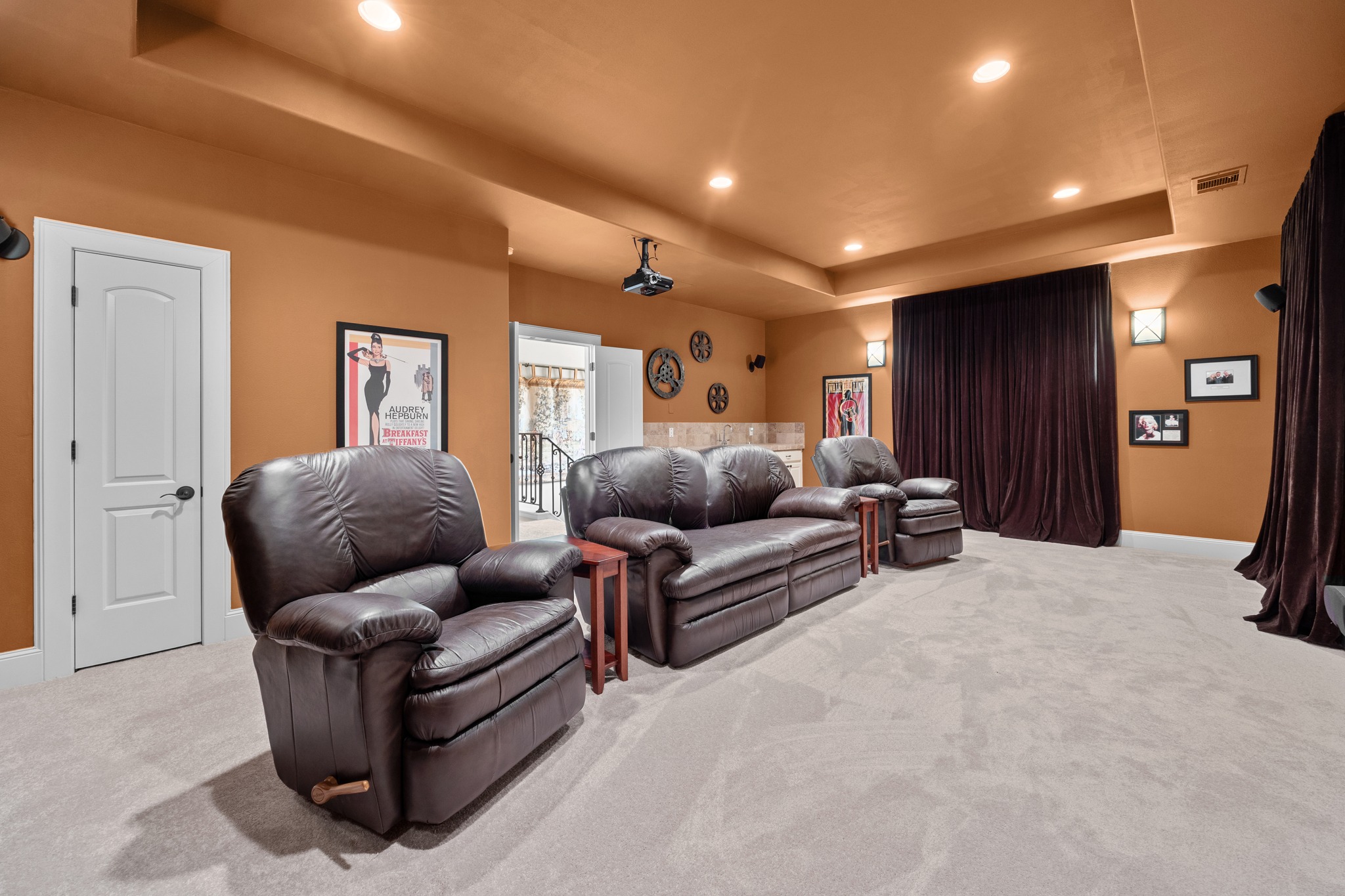 Media room with wet bar — theater equipment conveys