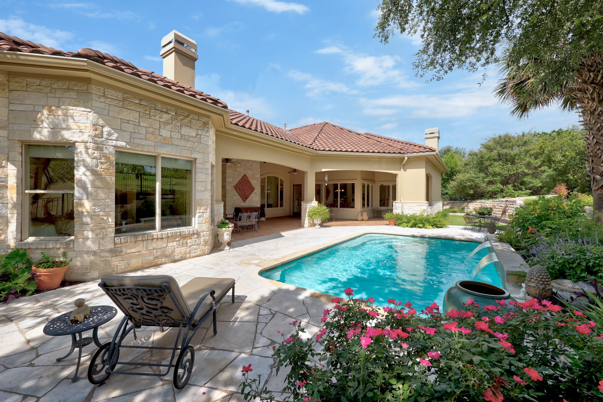 802 SF covered outdoor kitchen with built-in grill and fireplace