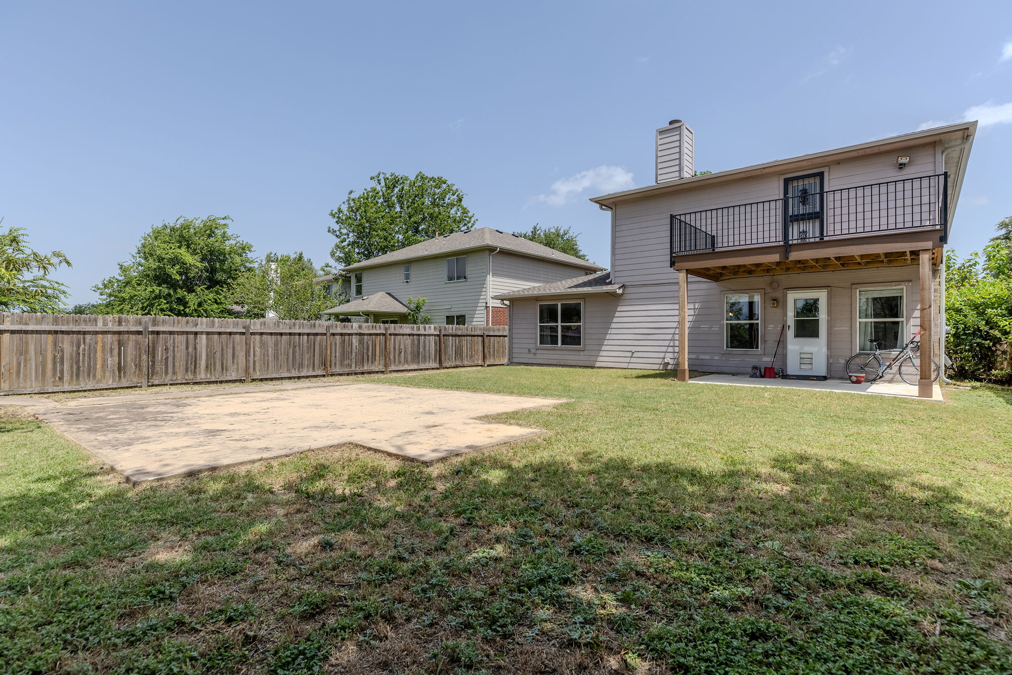 Attached two-car garage with wide driveway