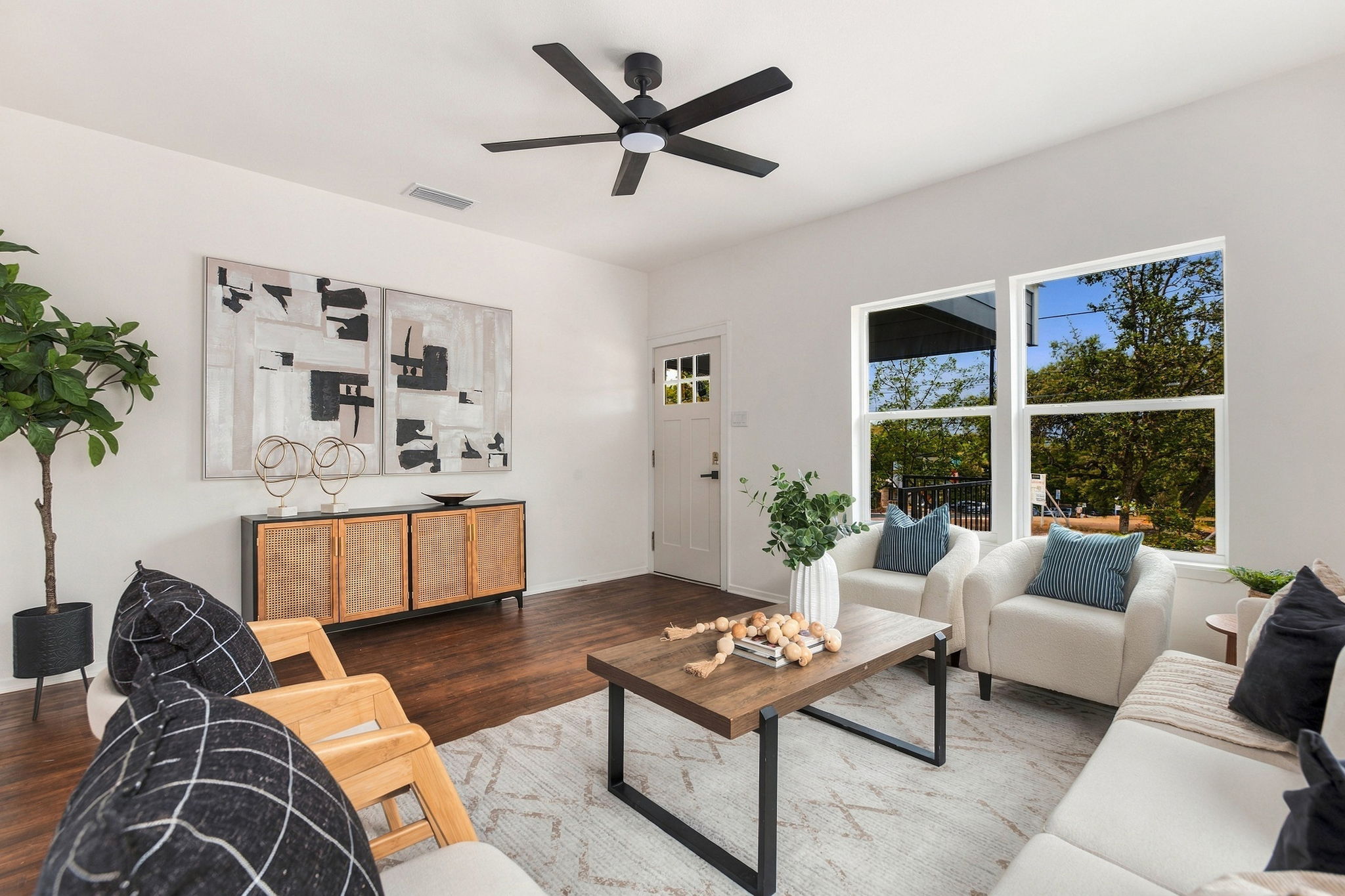 Living room with large windows beside the front door