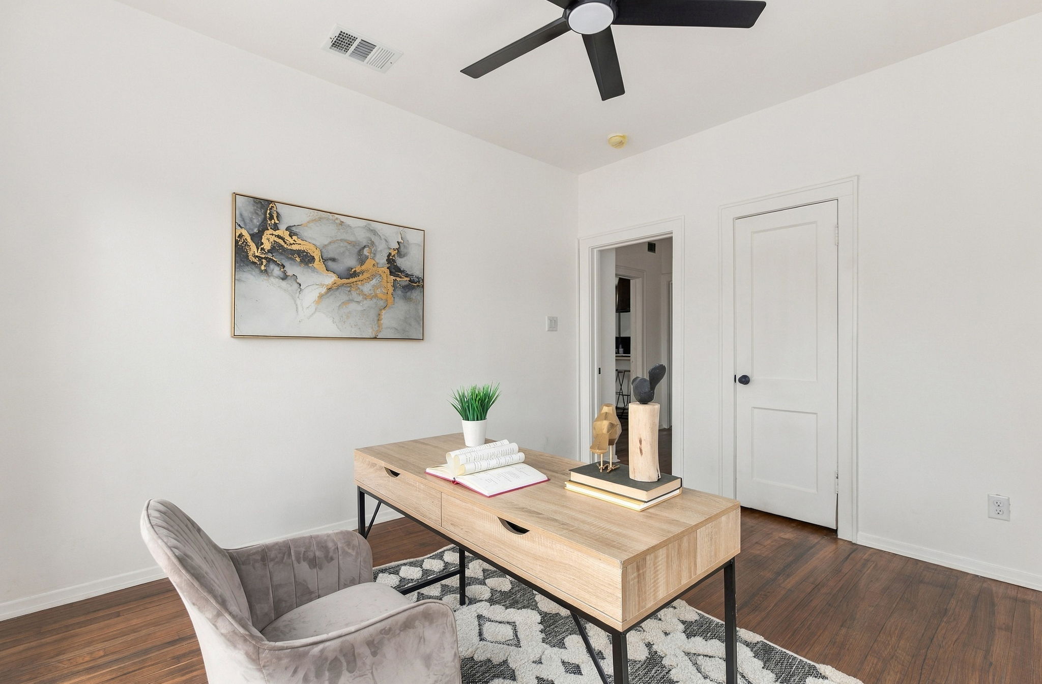 Second bedroom with a ceiling fan and closet