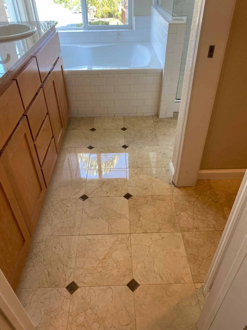 Master bathroom marble floor after professional restoration in San Jose CA