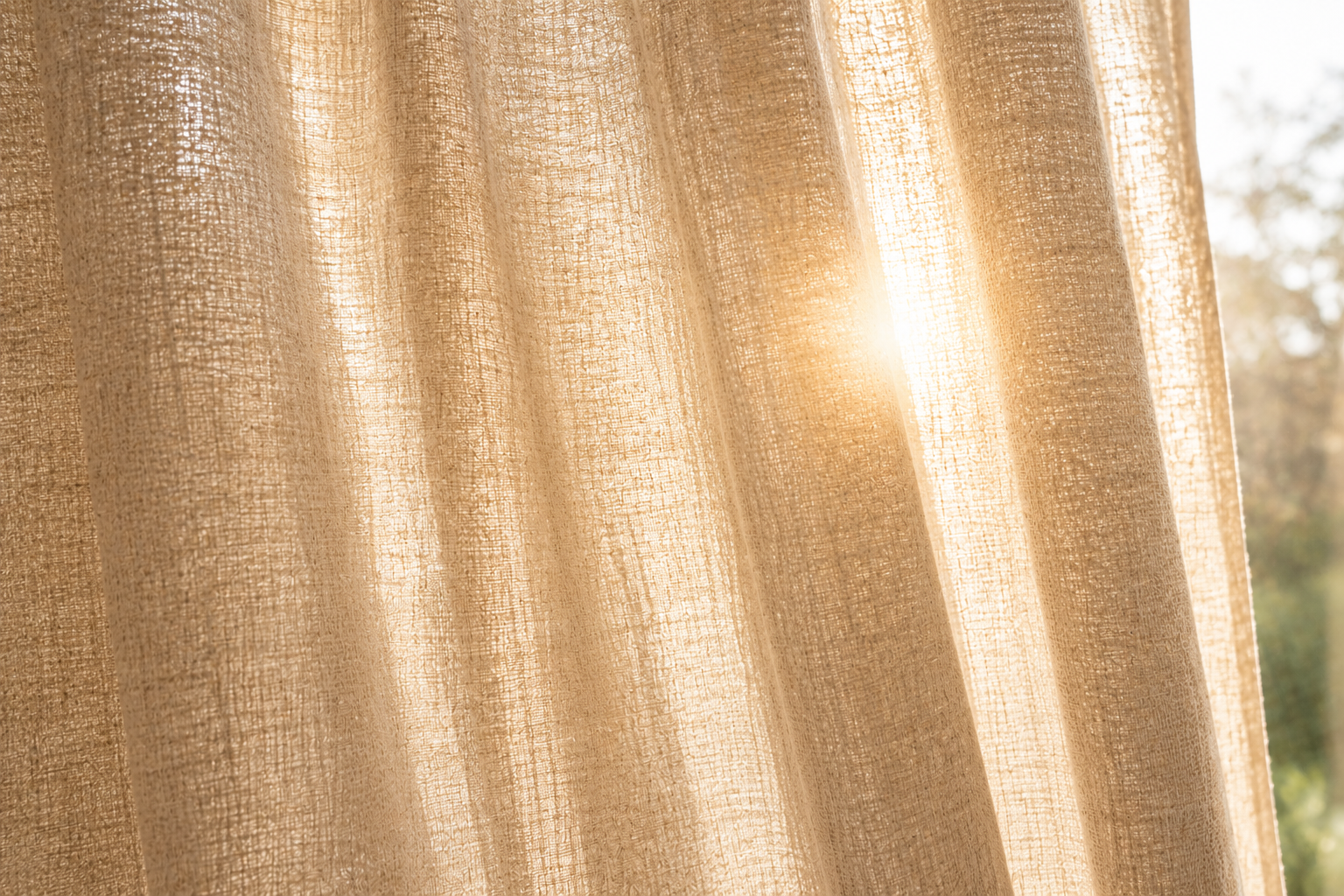 Light-filtering linen drapery softening natural sunlight in a living room Light-filtering linen drapery softening natural sunlight in a living room
