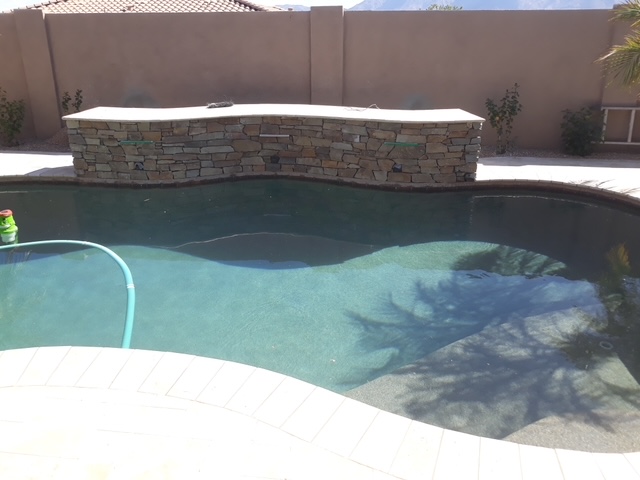 Finished natural stone water wall with spouts Arizona