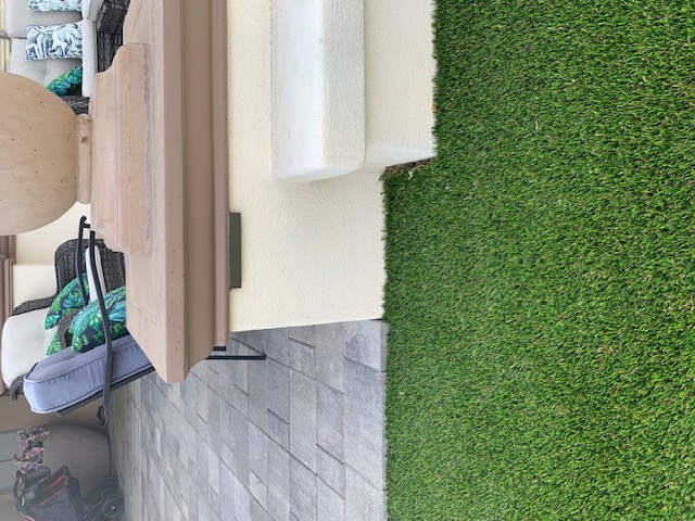 Modern white wall home with turf Tempe