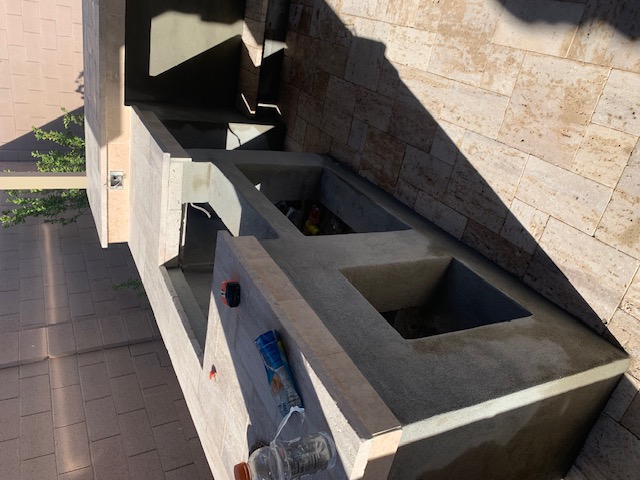 Wide outdoor kitchen with desert landscaping Arizona
