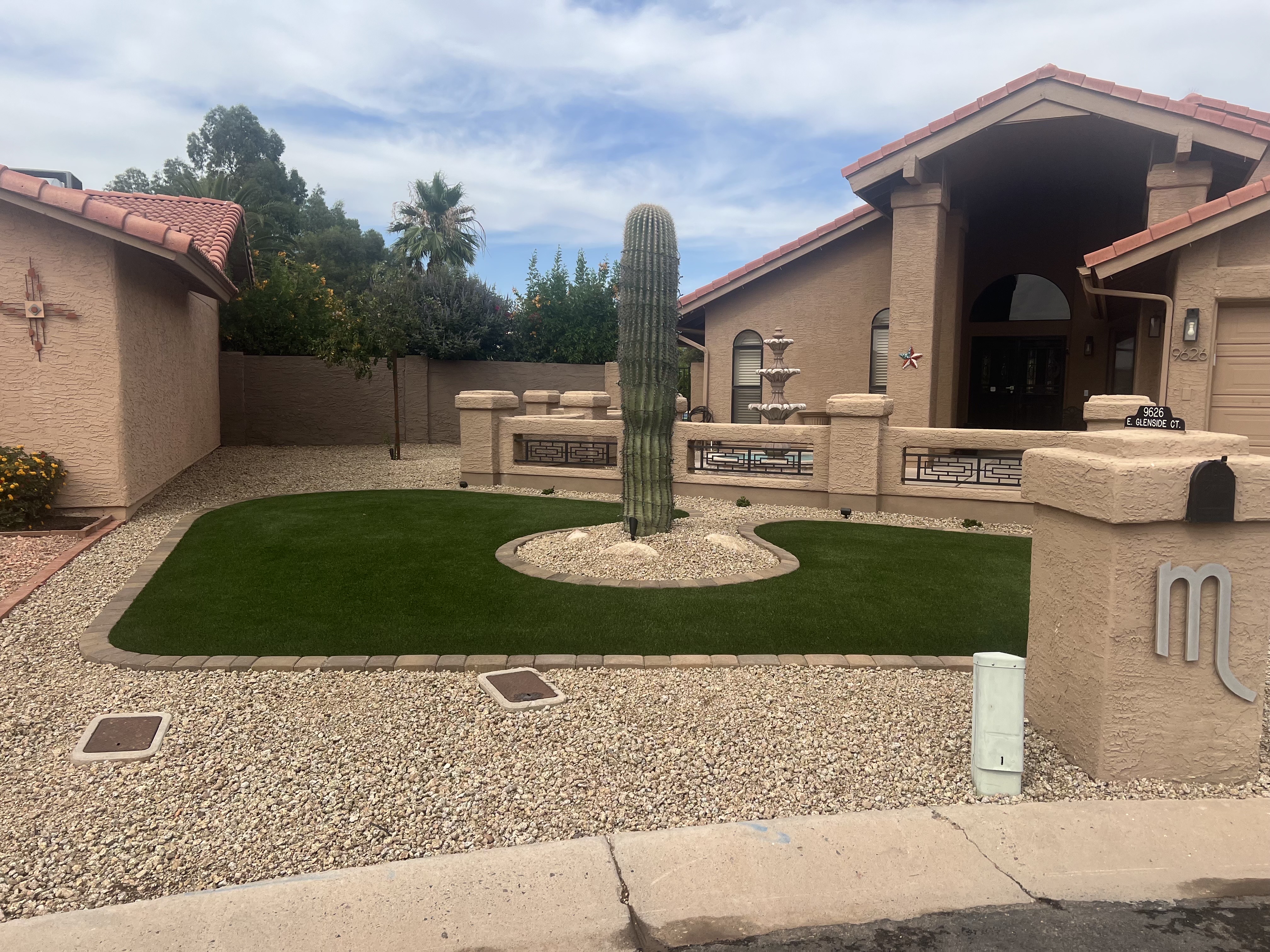 After — premium turf with stone steps and pavers