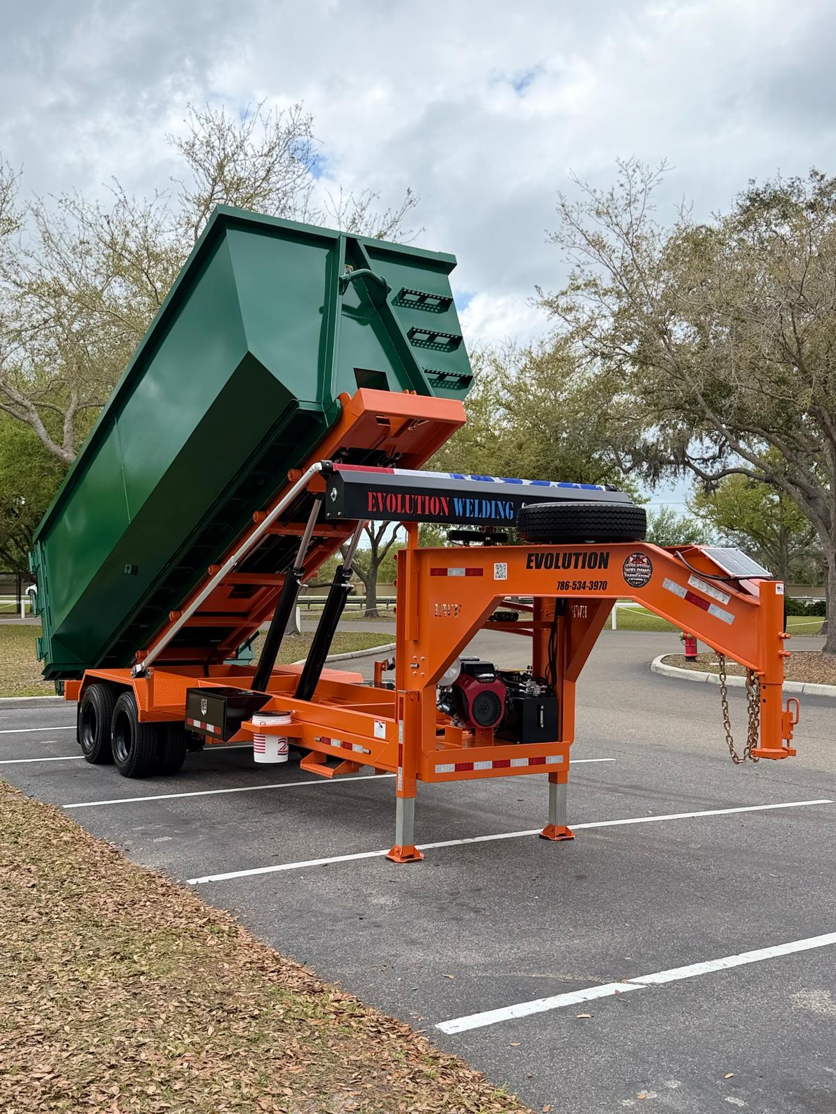 Original orange Evolution reeving trailer with green container