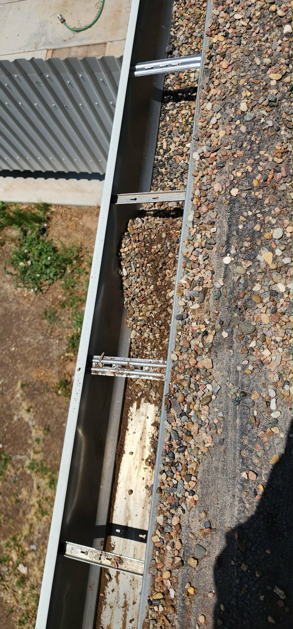 Gutter guards installed on a residential roof in Albuquerque