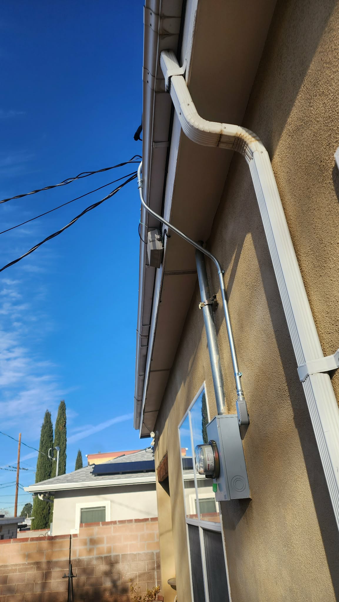 Gutter replacement work on an existing roof drainage system
