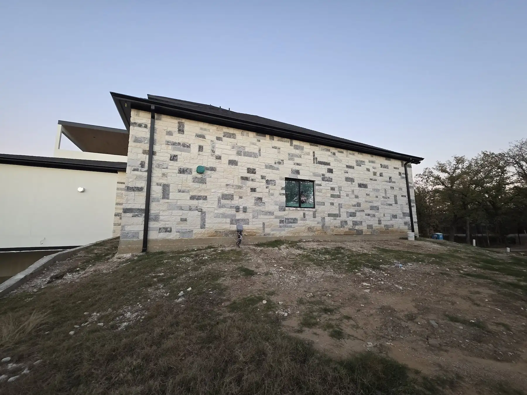 Home with a gutter along a low-slope roof edge