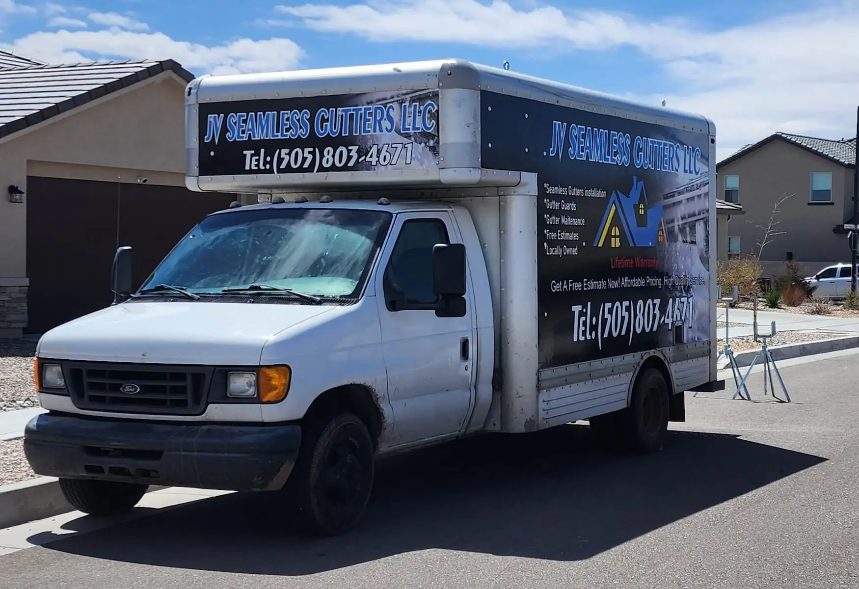 Company box truck parked at a job site