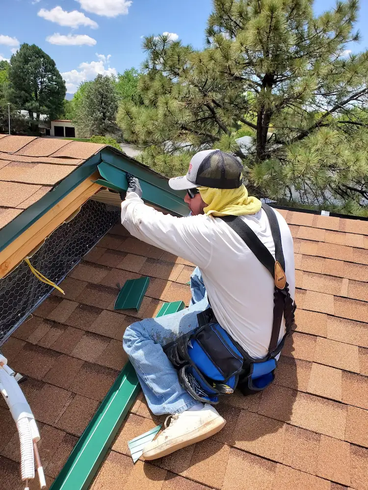 Continuous gutter along a home's roof edge.