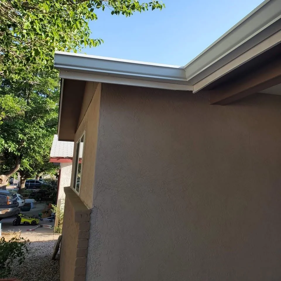 Close view of a gutter connected to a downspout.