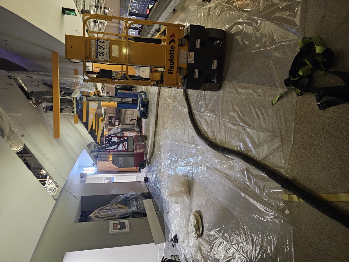 Commercial spray foam installation with professional equipment