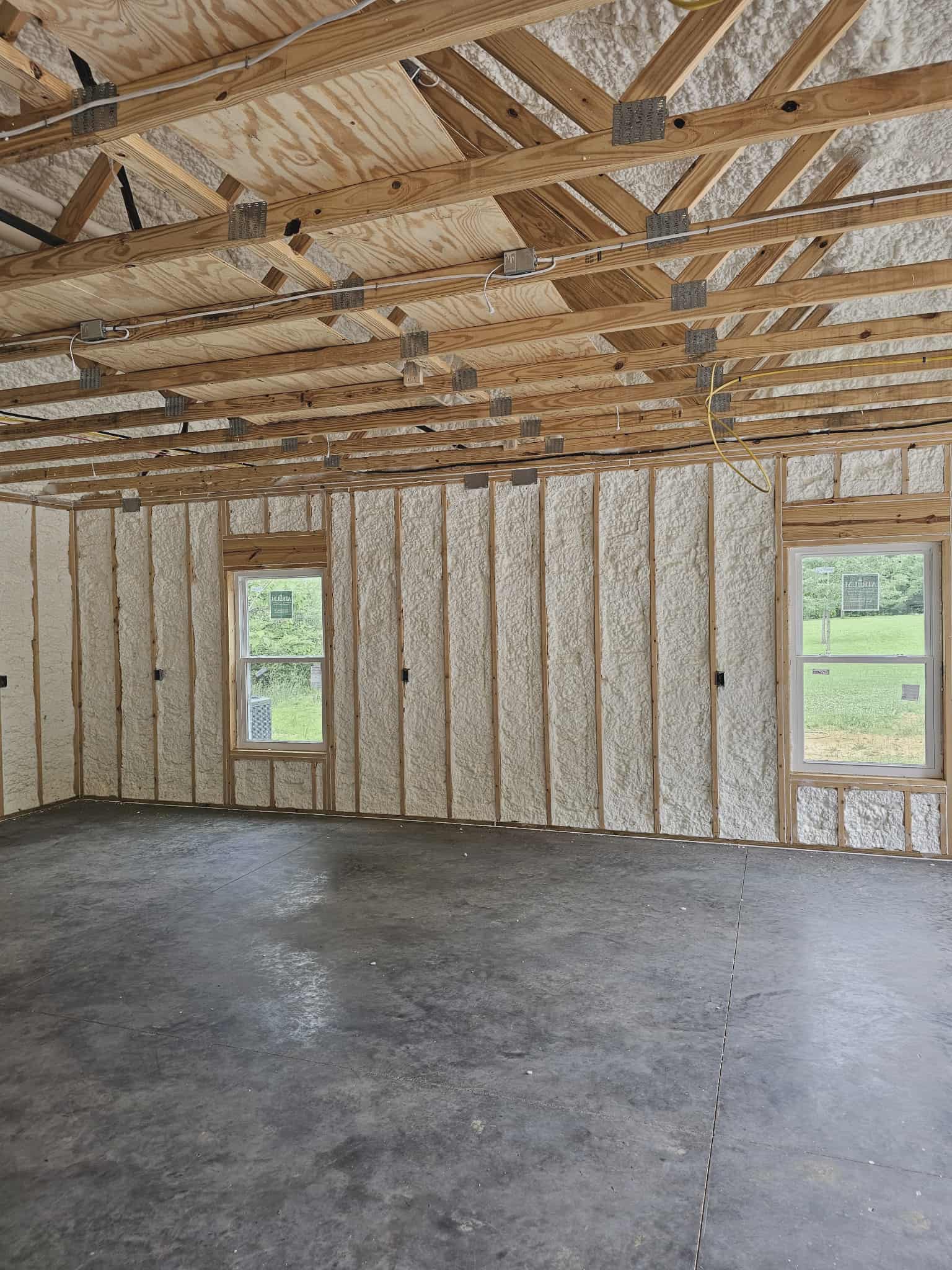 Spray foam insulation on walls and ceiling in new construction