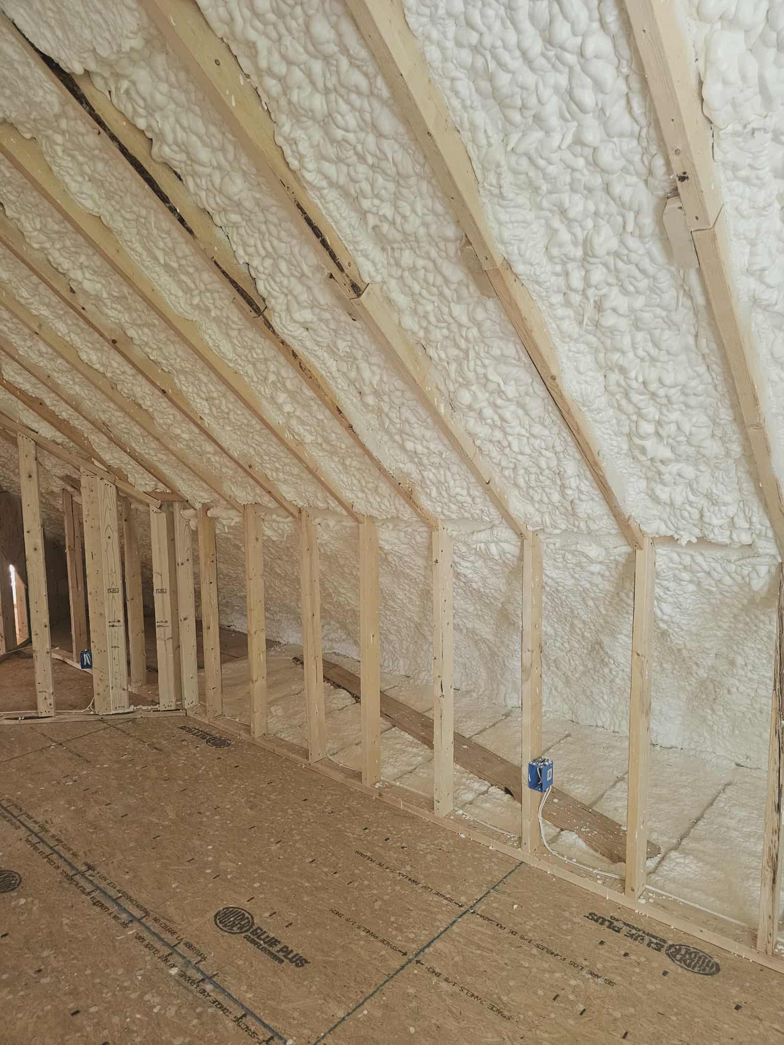Spray foam insulation applied to attic roof and walls