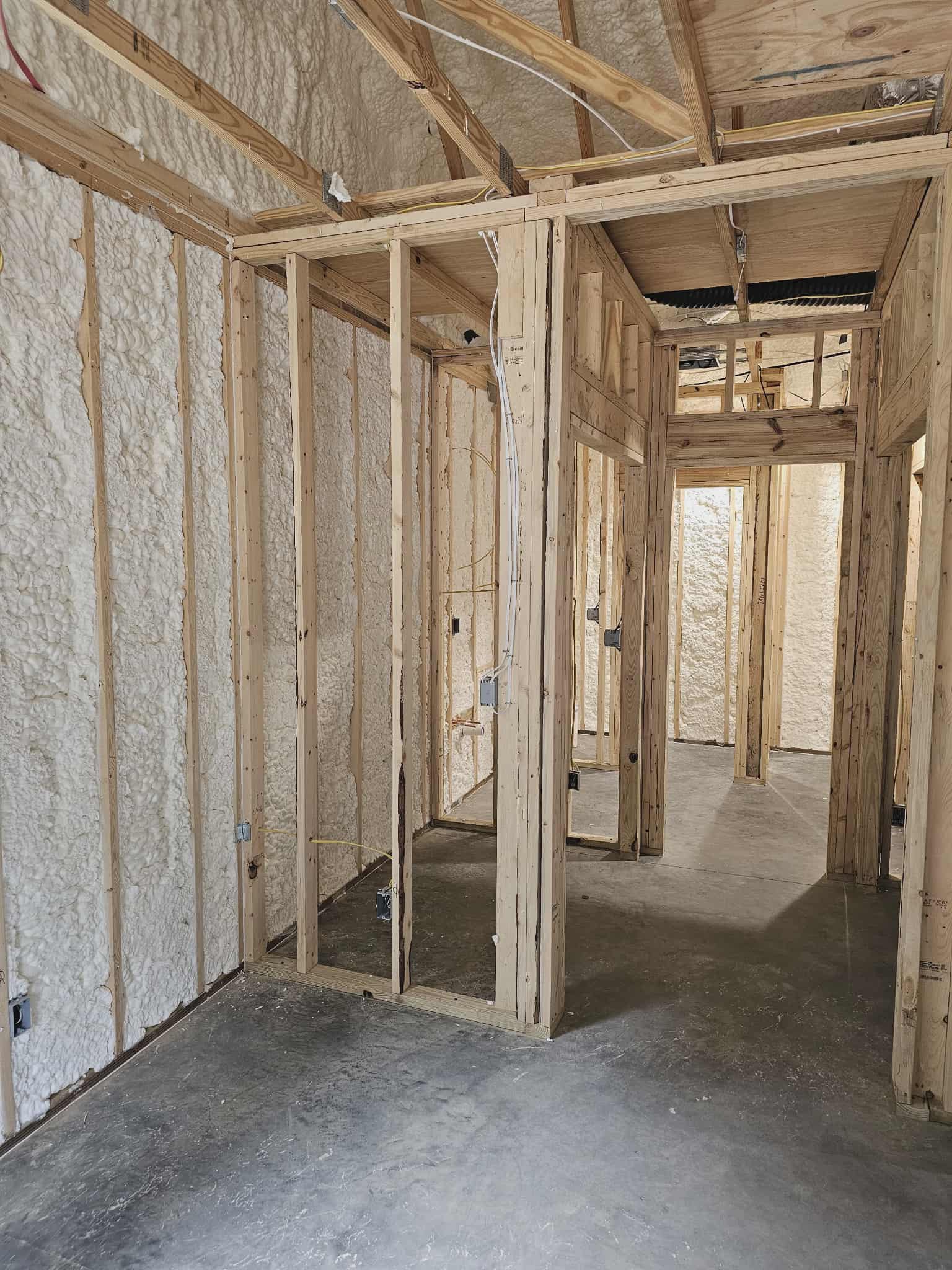 Spray foam insulation on interior walls in new construction home