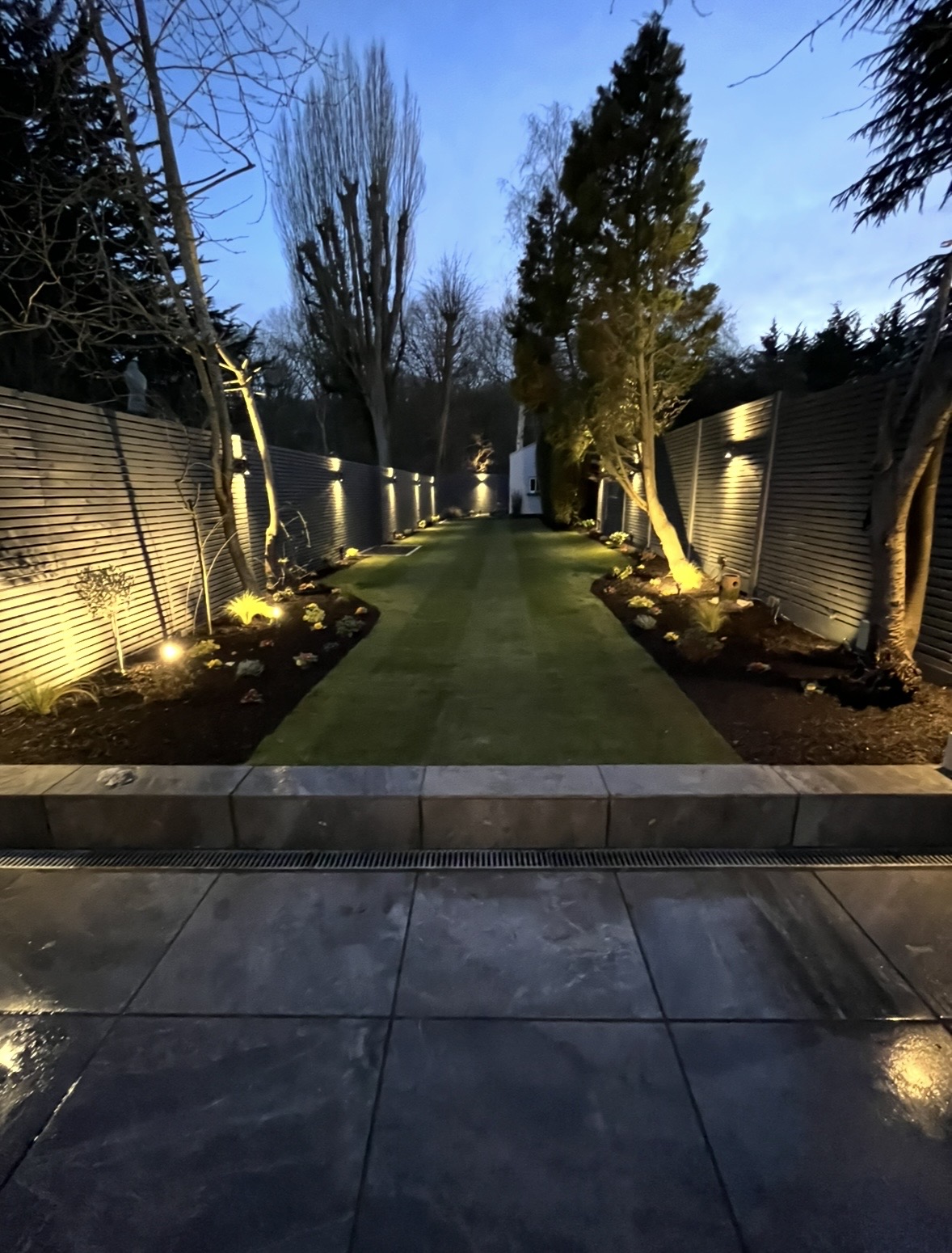 Finished garden with porcelain patio and lawn
