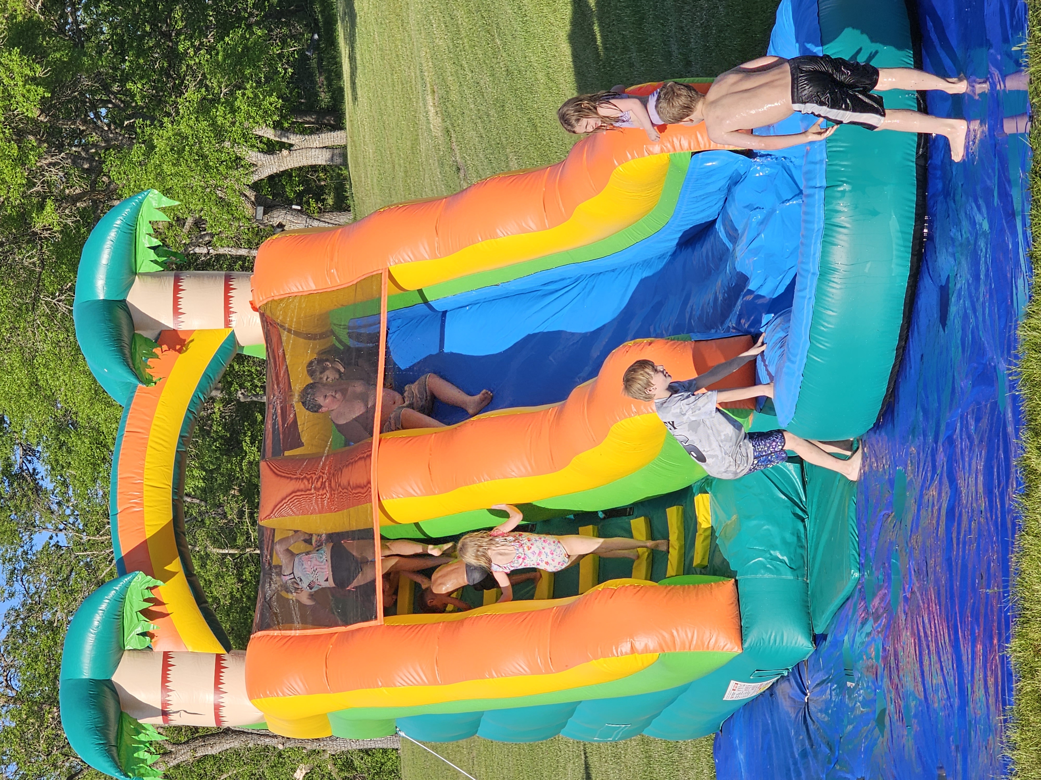 Kids having a blast in the bounce house at The Boil at Big Rock Creek
