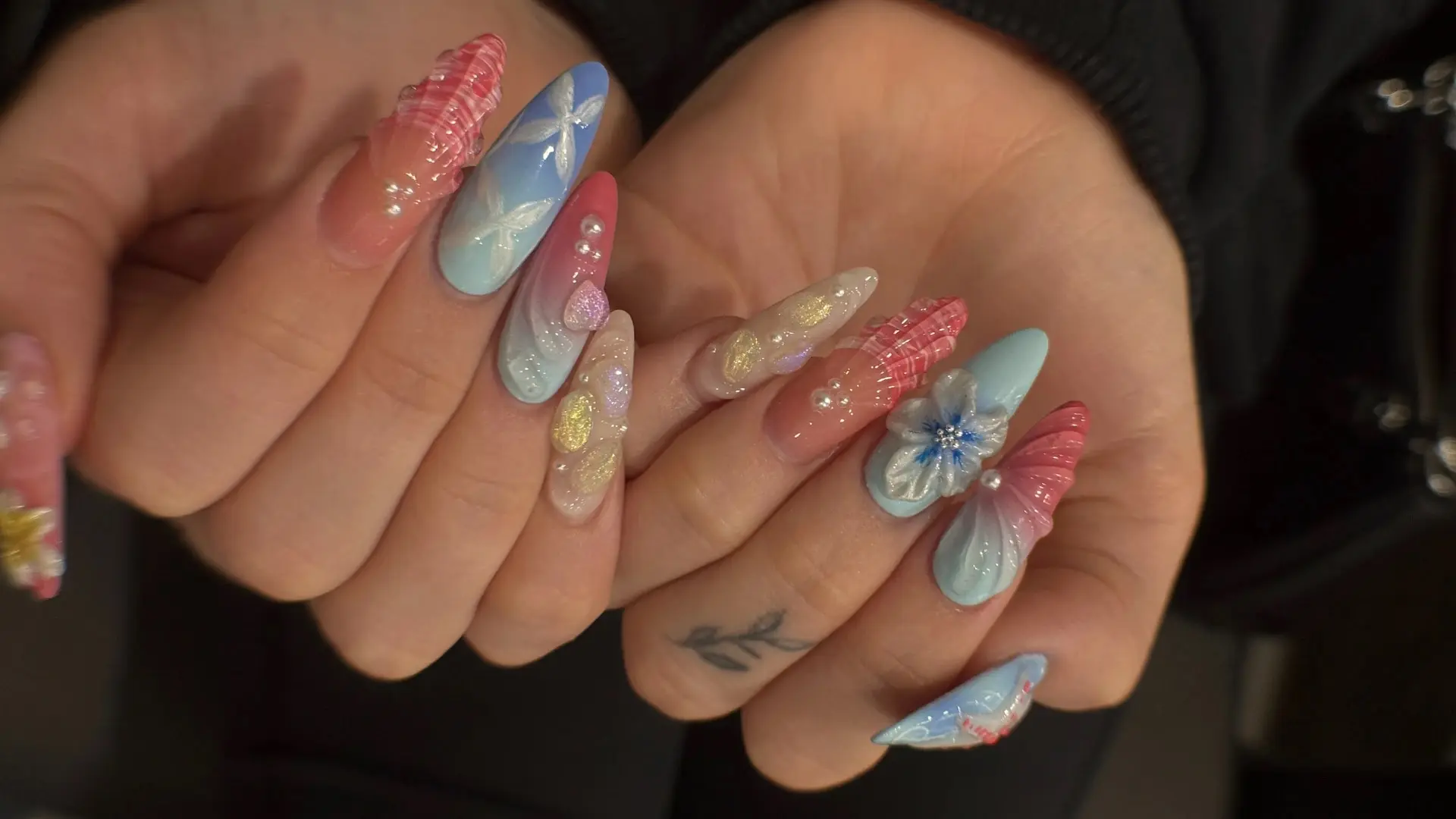 Showing nail arts on a guest's nails at Ballerina Nails and Spa