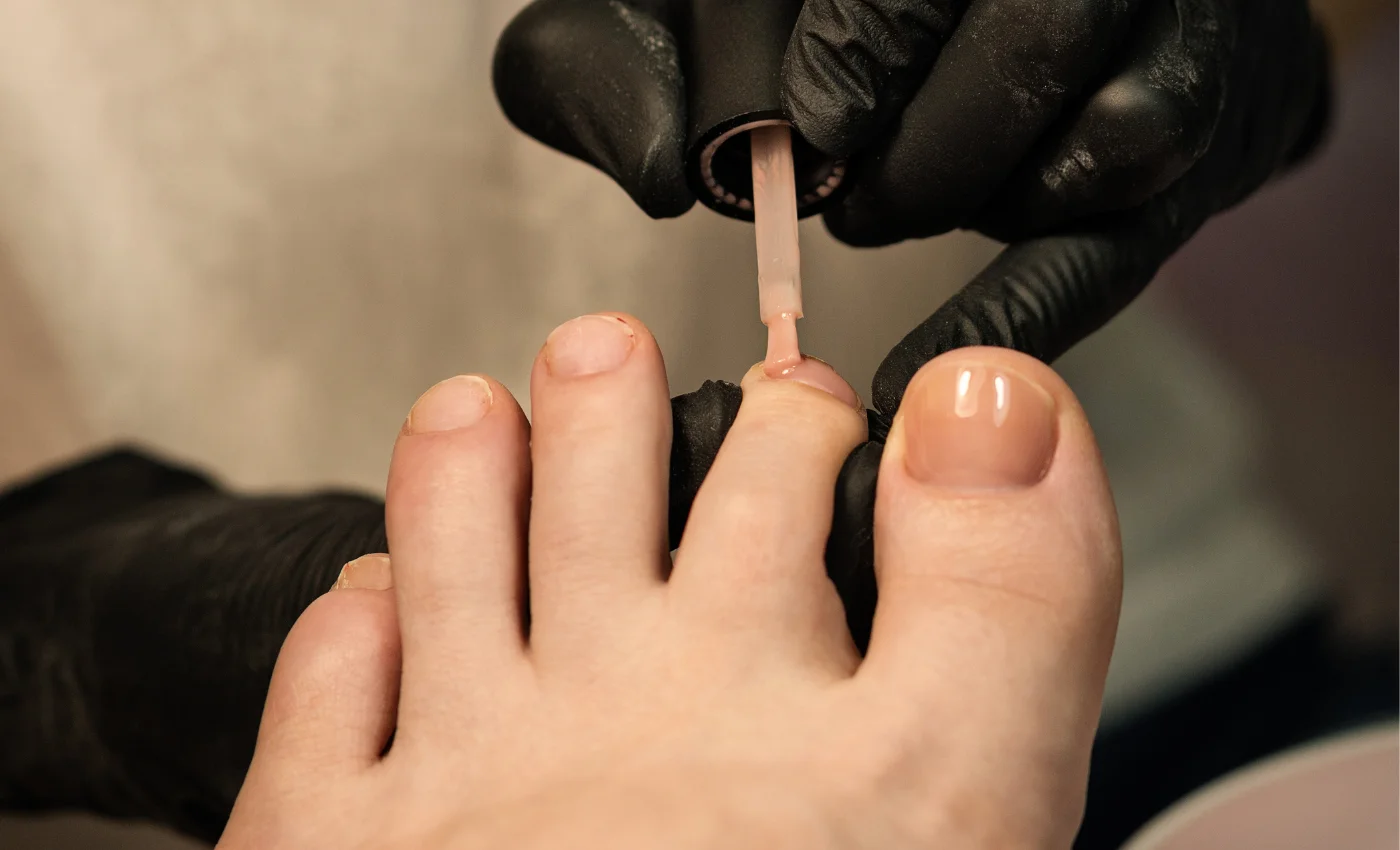 A client relaxing during a detox spa pedicure experience