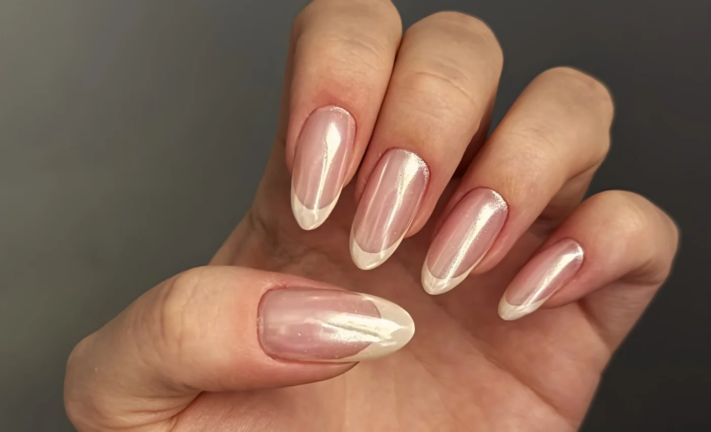 A client showing long acrylic nail extensions