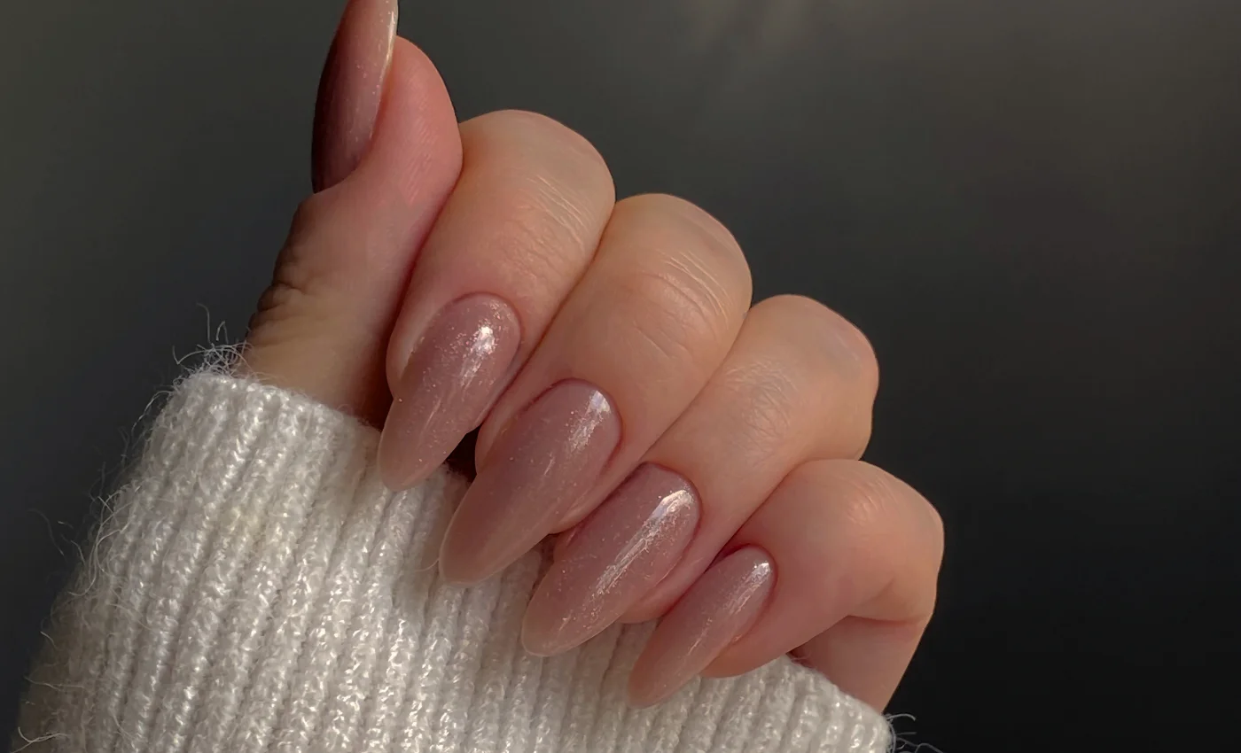 A client showing refreshed IBD gel nails after a refill