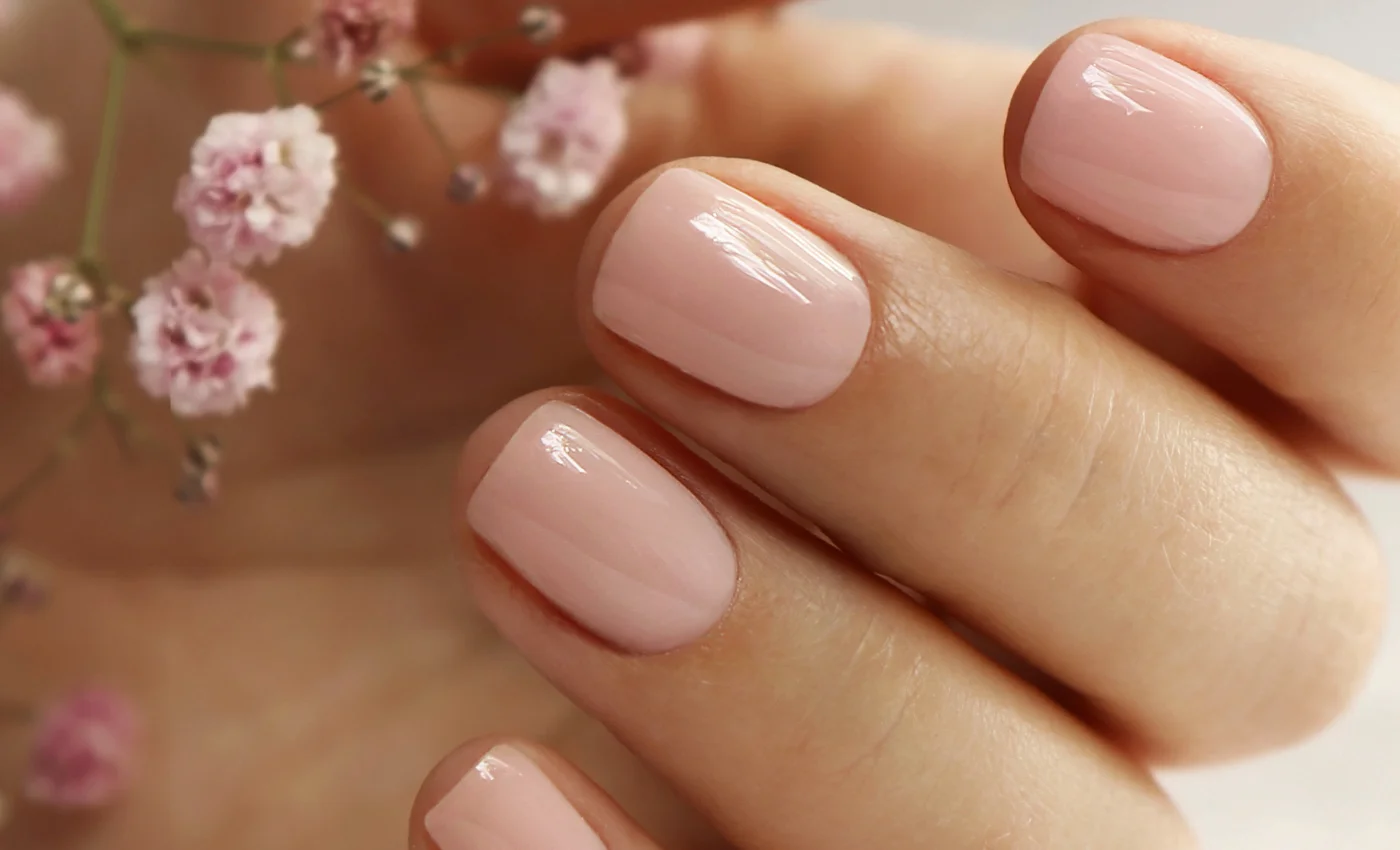 A client showing finished dip powder nails
