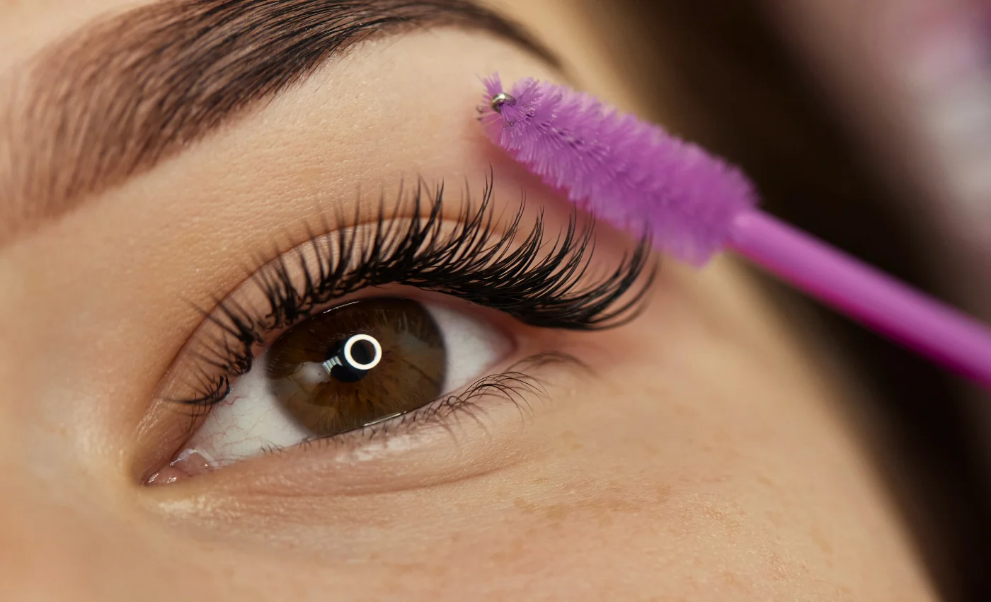 A technician working on a client's lash