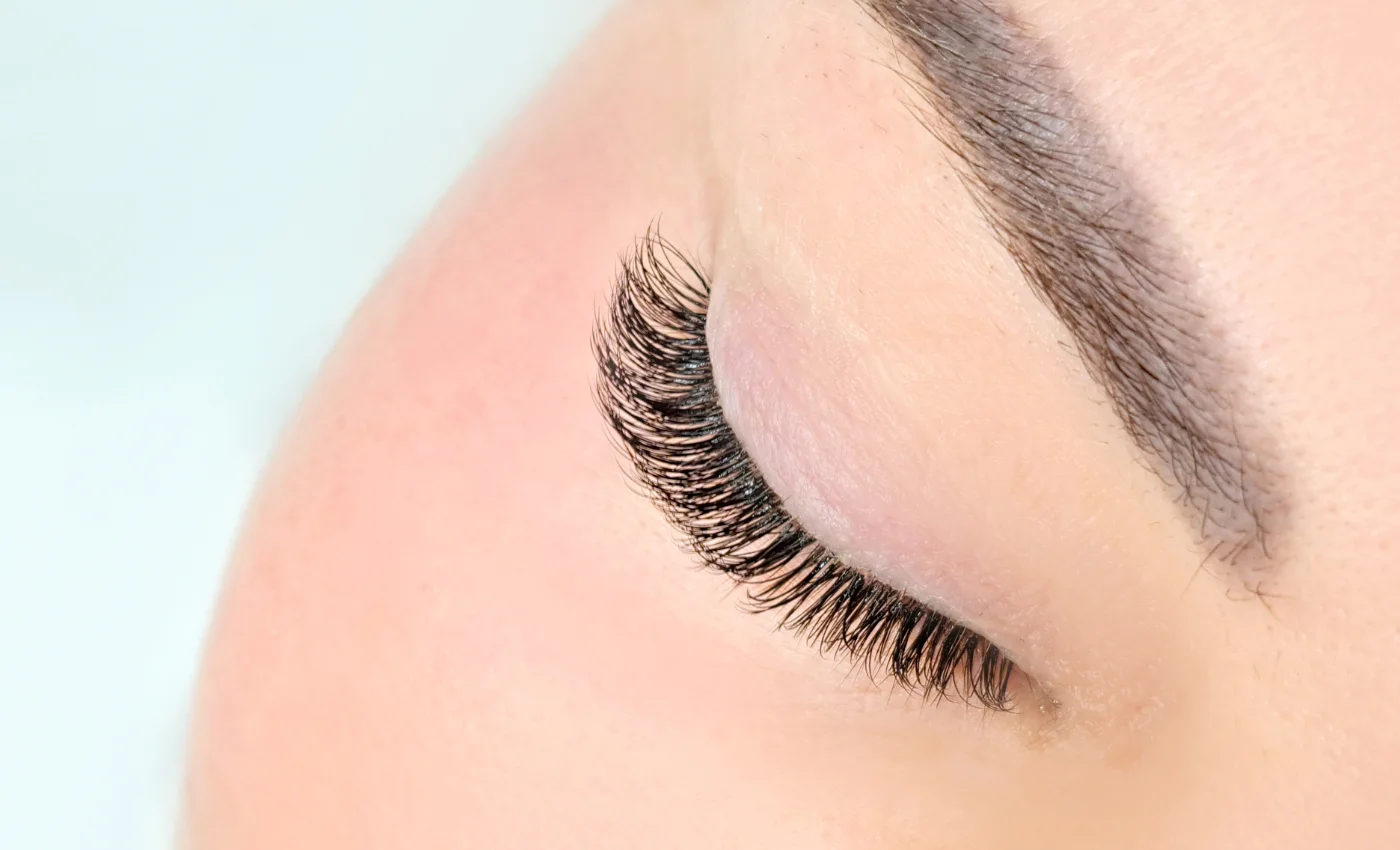 A client showing refreshed volume lash extensions