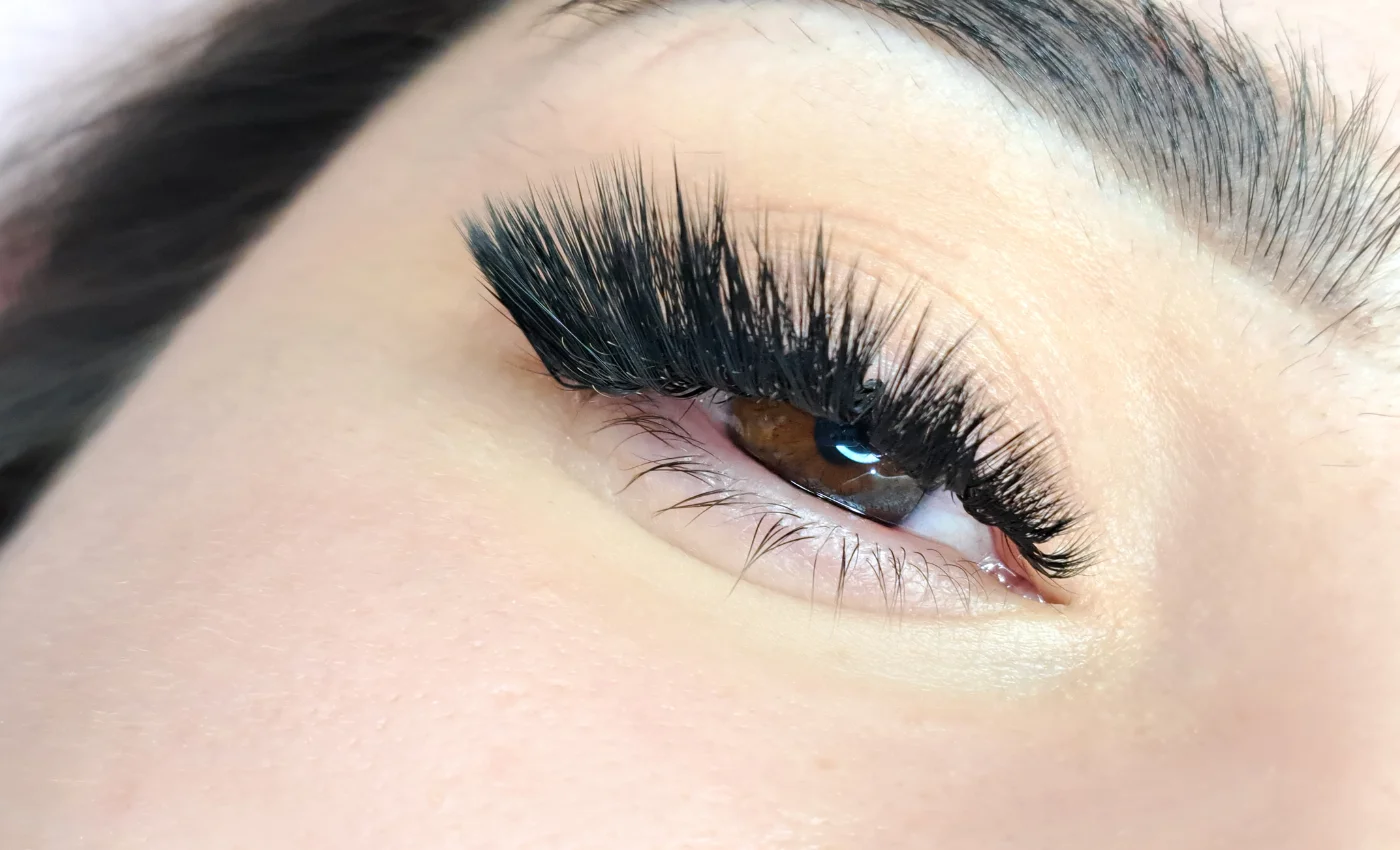 A client showing full volume lash extensions