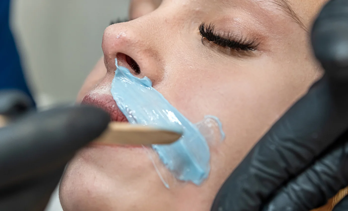 A client with smooth skin after a lip wax service
