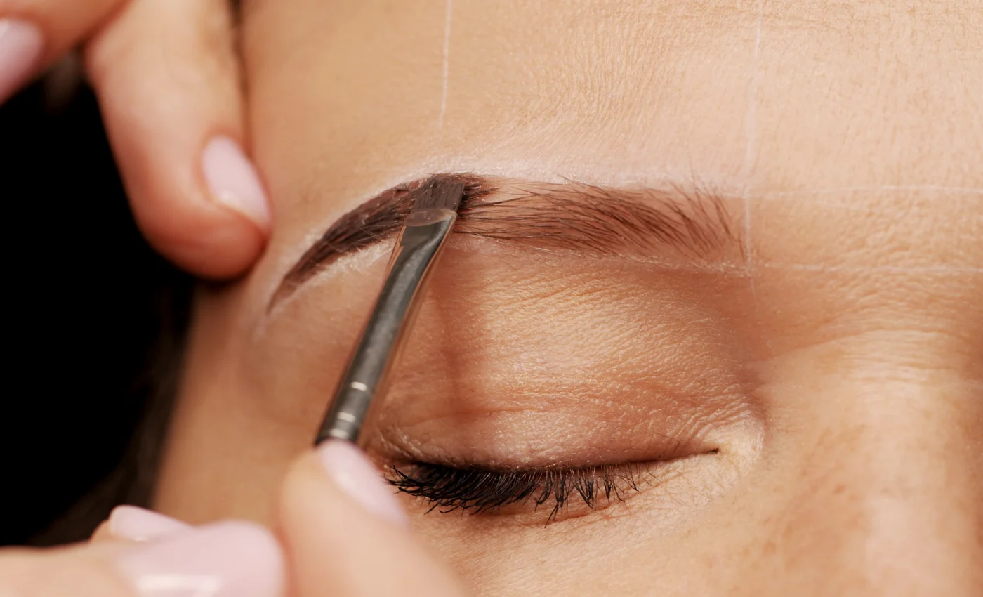 A client showing fuller-looking brows after brow tint