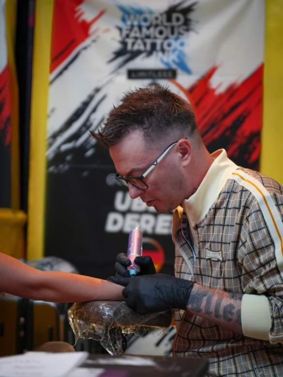 Derek Entenmann, UberDerek, tattooing at an international tattoo convention