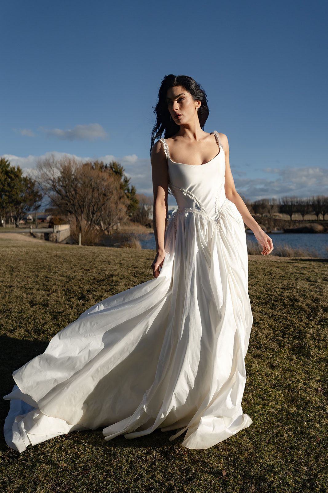 The Sable, a full skirt catching the wind by the water