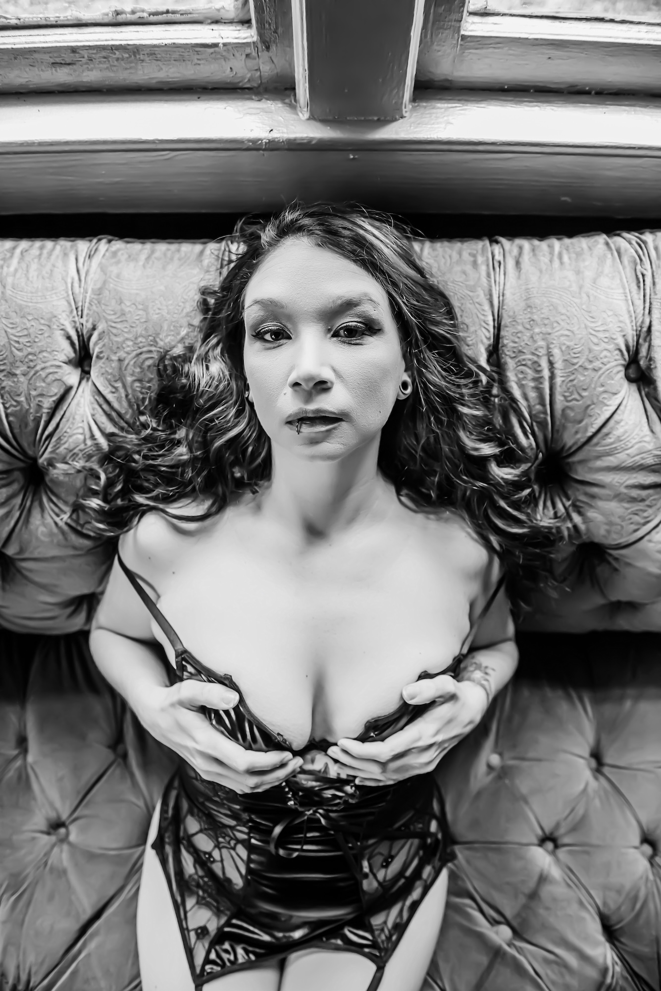 woman wearing red corset and black angel wings