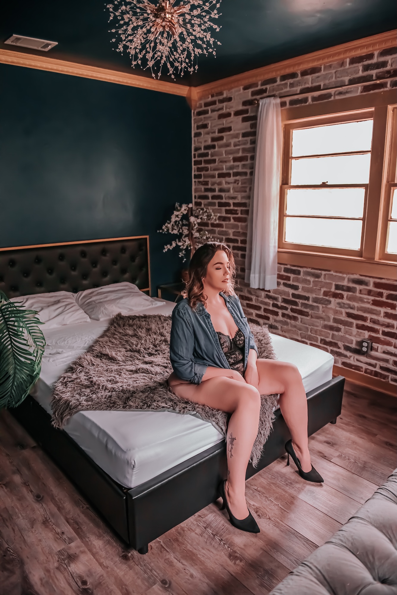 photo of back of woman kneeling on couch
