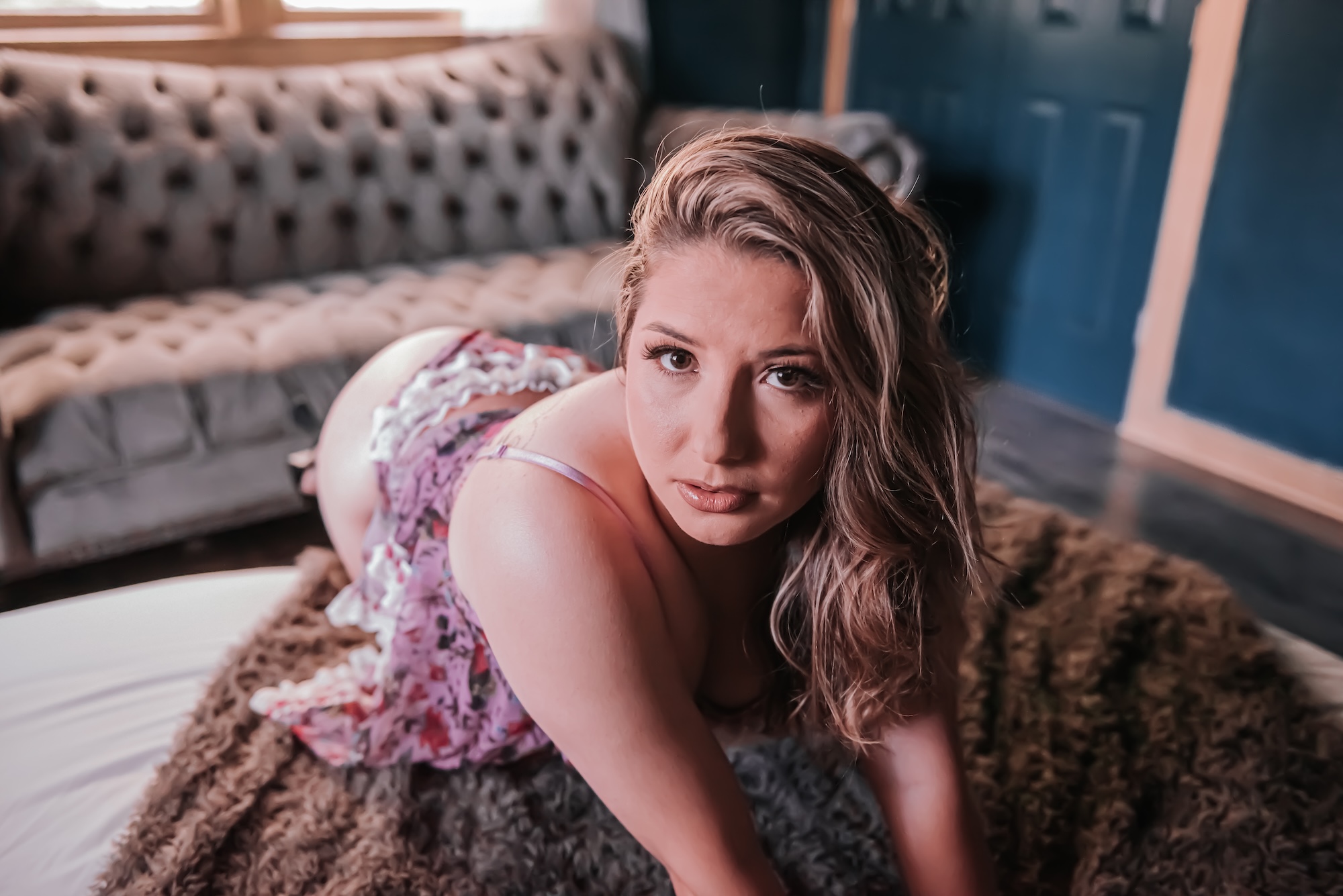 woman in brown dress lounging on stairs