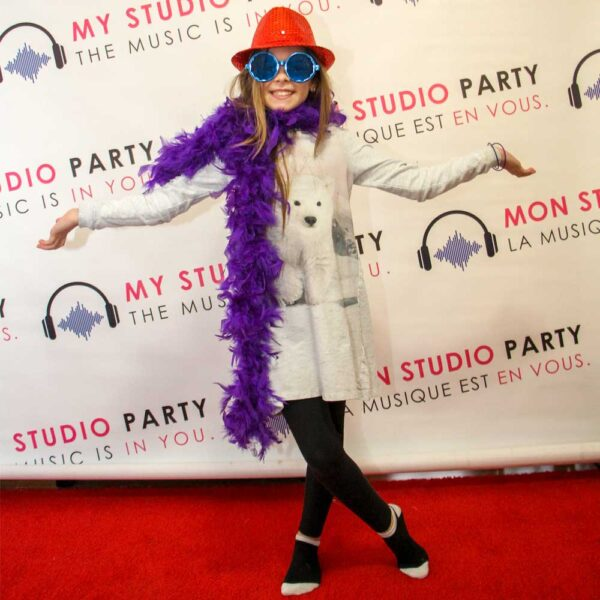 Kid on the My Studio Party red carpet in party accessories