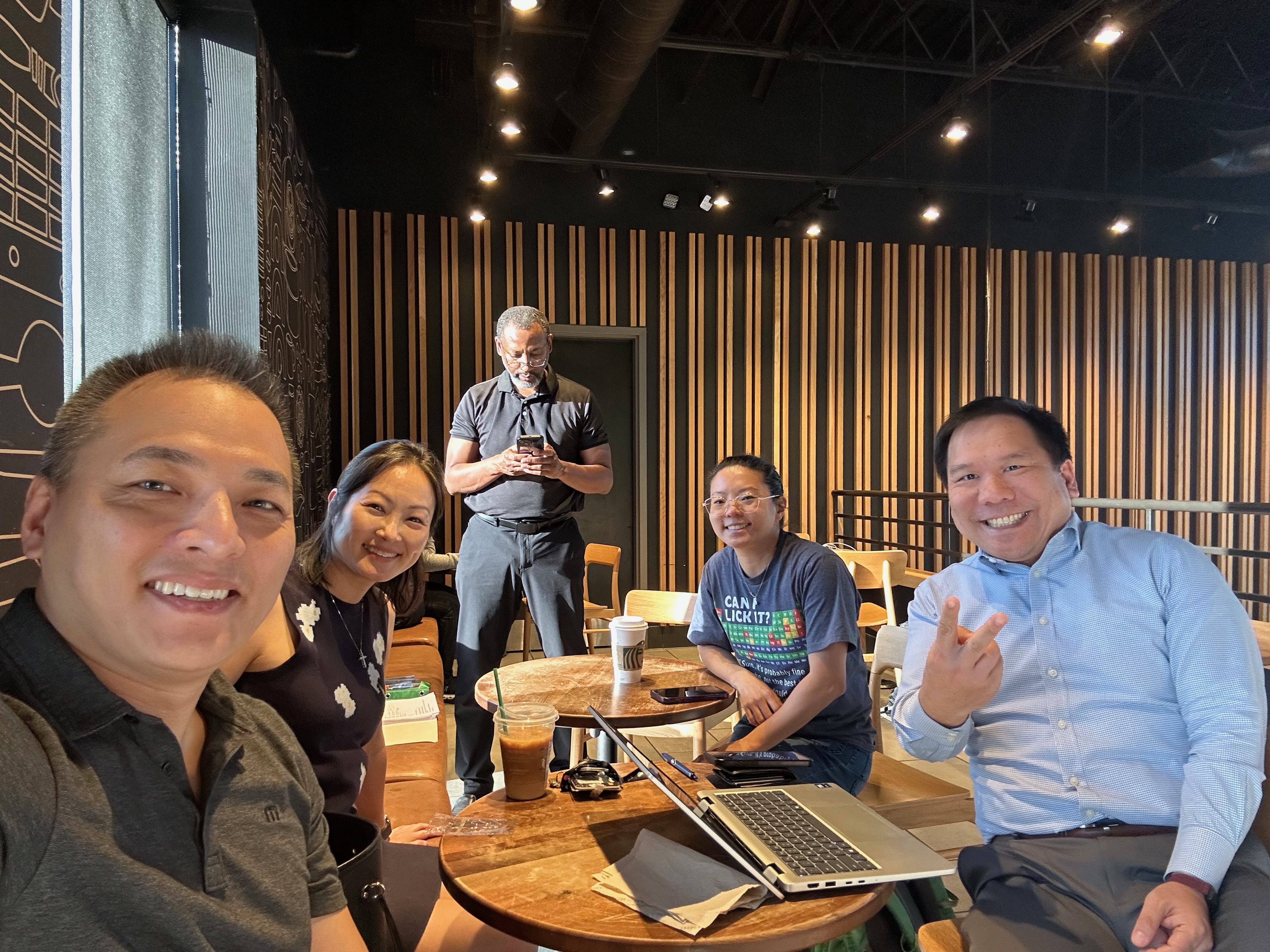 Wei with community members at a coffee meetup