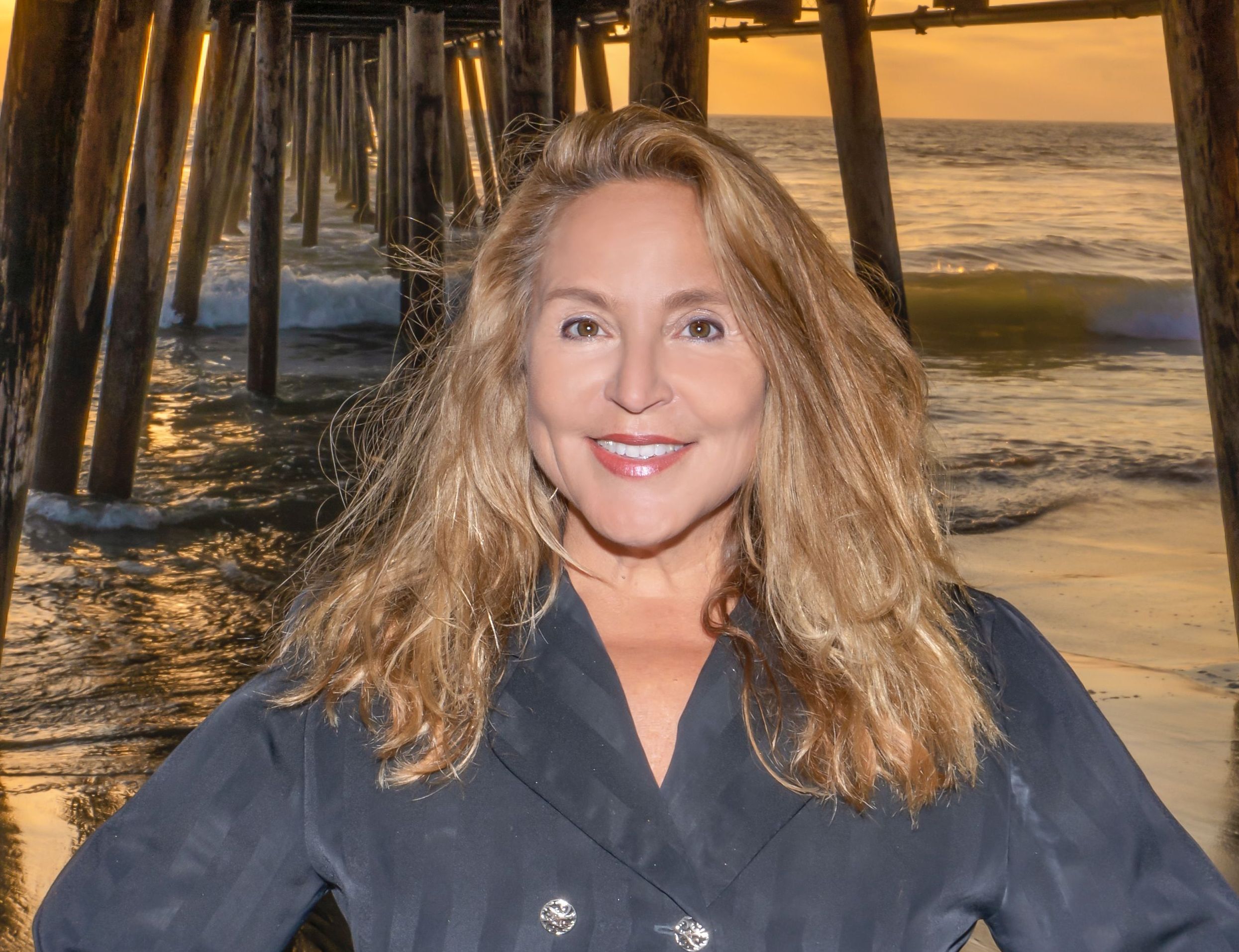 Deborah Vance, smiling Realtor on the Seacoast Drive pier in Imperial Beach