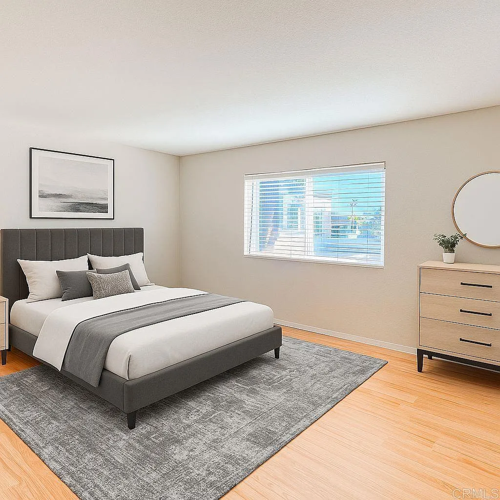 Spacious bedroom with vaulted ceilings and dual-pane windows